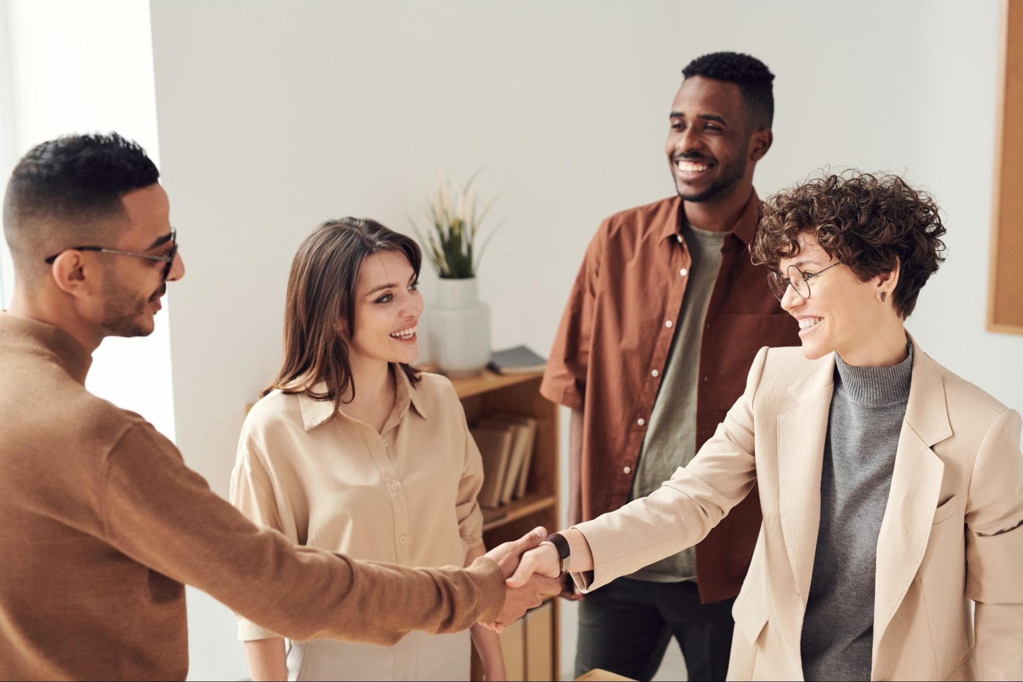 4 people meeting and greeting each other