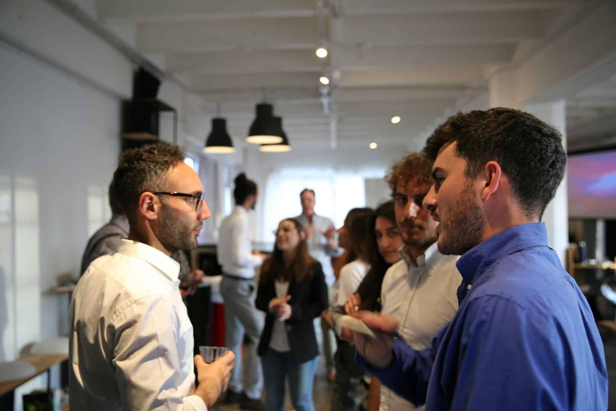 a group of people engaging in a conversation at a networking event